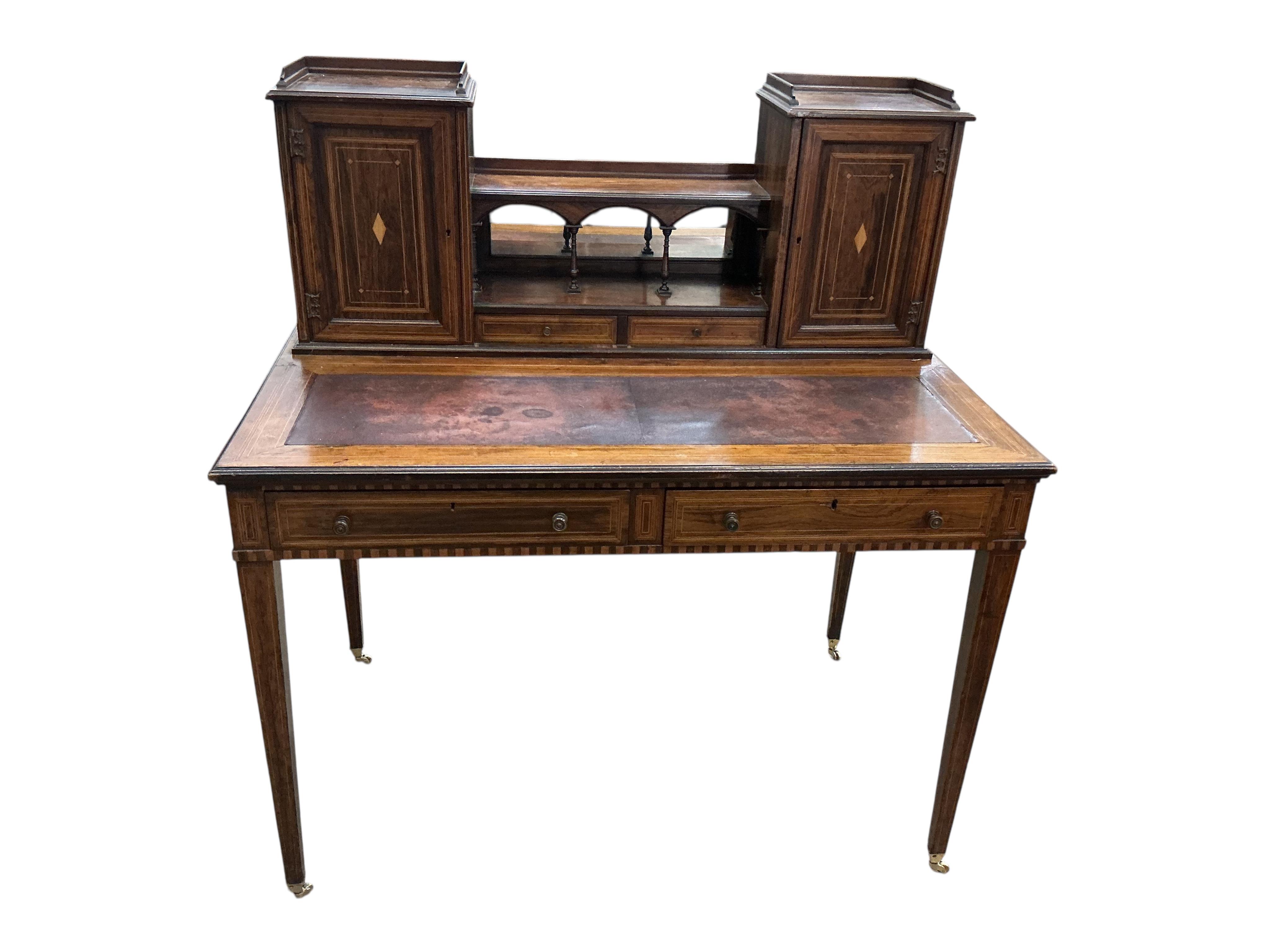 An Edwardian Edwards & Roberts inlaid rosewood desk, width 107cm, depth 66cm, height 114cm